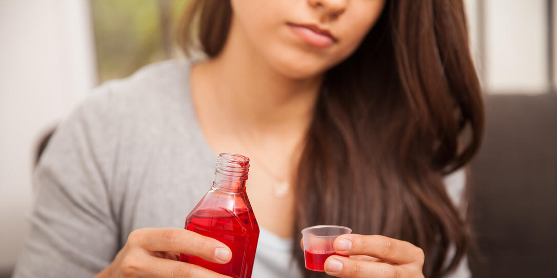 Drinking some cough syrup