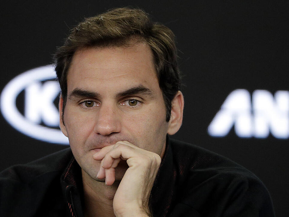 Switzerland's Roger Federer answers questions during a press conference at the Australian Open tennis championships in Melbourne, Australia, Sunday, Jan. 14, 2018. (AP Photo/Dita Alangkara)