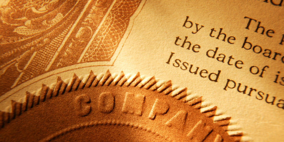Close up of a company seal on old stock certificate Close up of a company seal on old stock certificate