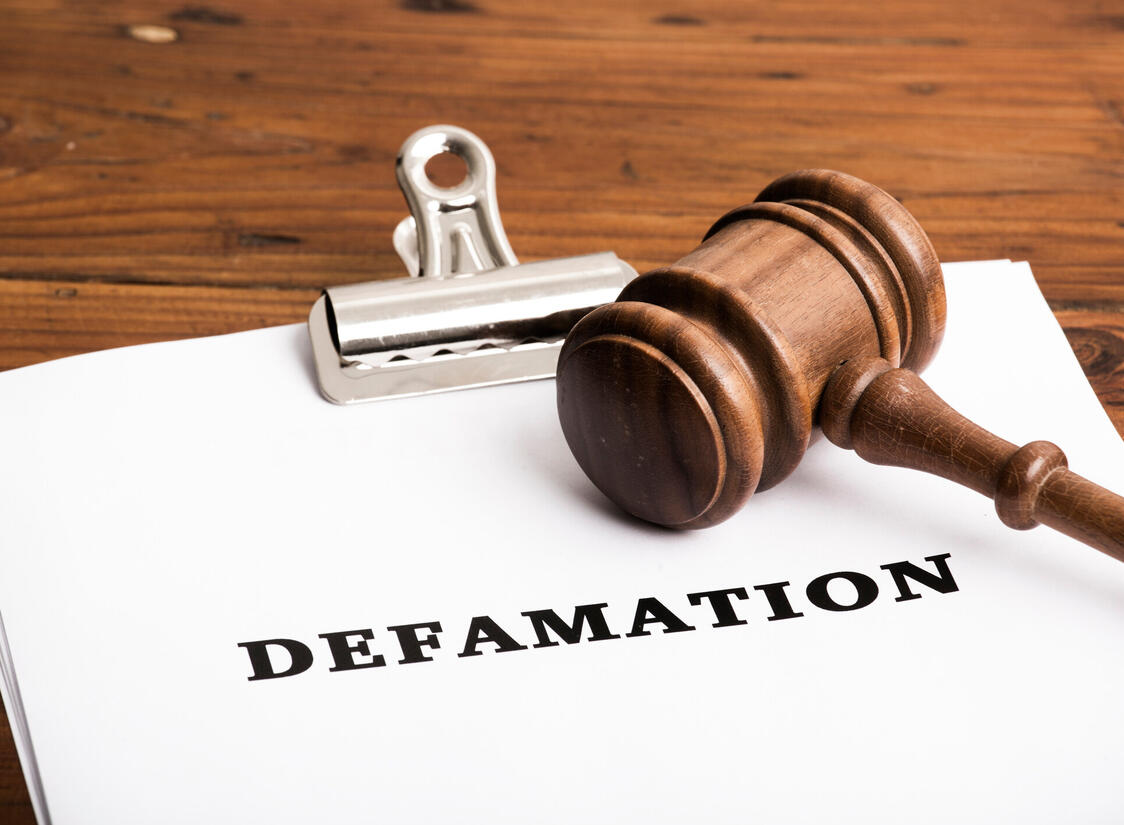 Defamation file in court with gavel Defamation file in court with gavel