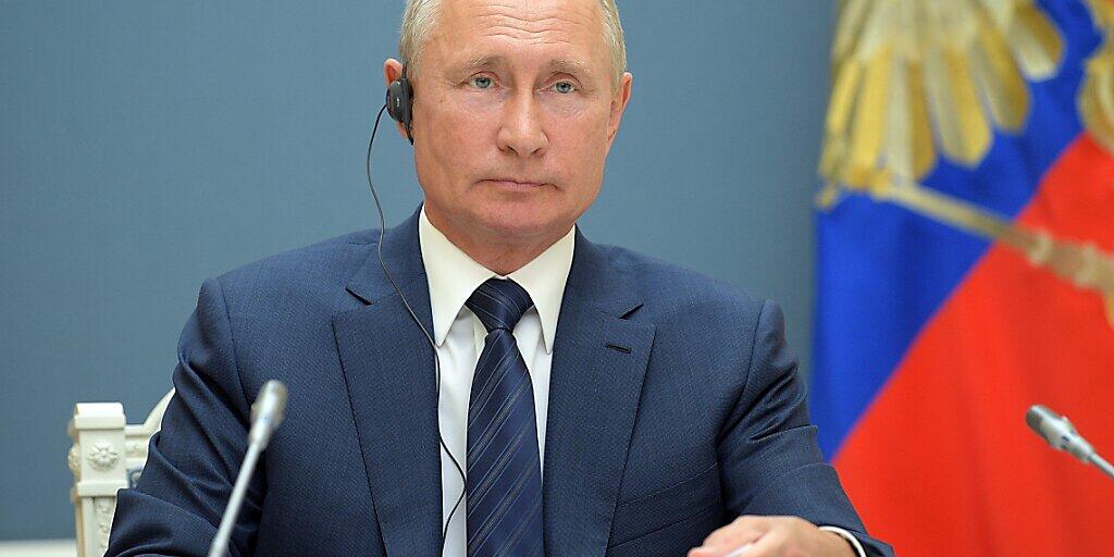 HANDOUT - Die Operation Machterhalt für Kremlchef Wladimir Putin hat erwartungsgemäß ihre letzte Hürde genommen. Foto: Alexei Druzhinin/Pool Sputnik Kremlin/AP/dpa