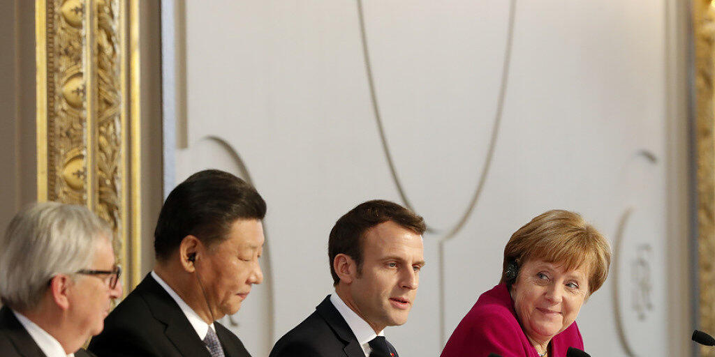 Trafen sich am Dienstag in Paris (v.l.n.r): Jean-Claude Juncker, Xi Jinping, Emmanuel Macron und Angela Merkel.