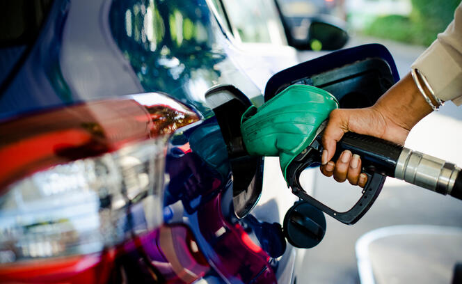 Man filling up gas in his car