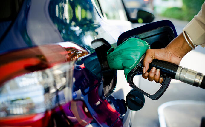 Man filling up gas in his car